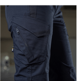 Nærbillede af M-Tac Bukser Aggressor Dame Flex i sort med lynlåslomme, designet til træning og udendørs aktiviteter