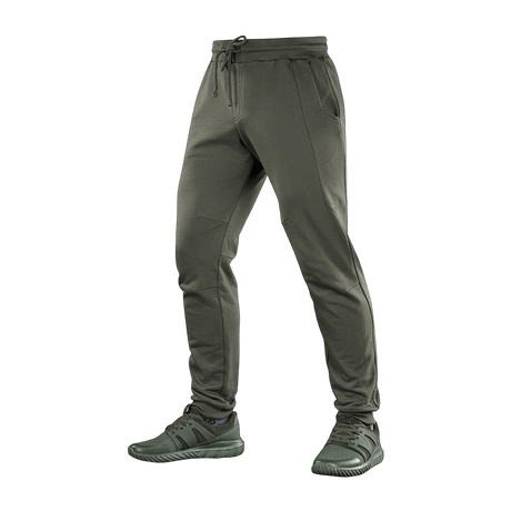 M-Tac Bukser Stealth Cotton sportsbukser i olivenfarve, 100% bomuld, med elastik i taljen og sidelommer, perfekt til løb og hverdag.