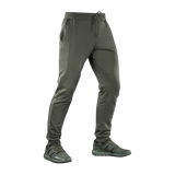 M-Tac Bukser Stealth Cotton i olivengrøn farve med to sidelommer og elastik, designet til komfort og bevægelsesfrihed under sport.