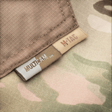 M-Tac Bukser Aggressor Elite NYCO med MultiCam mønster i NYCO rip-stop stof, ideel til taktisk brug og US Army kvalitet.