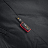 Etiket på M-Tac Alpha Gen.III Pro Vinterjakke med Cordura detaljer i sort stof.