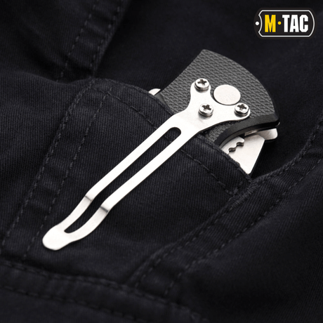 M-Tac Bukser Aggressor Vintage med kniv i lomme, viser slidstærkt design og funktionalitet. Perfekt til hverdagsbrug og feltarbejde.