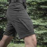 M-Tac Aggressor Summer Flex Shorts i Flex Rip-Stop stof til udendørs aktiviteter, vises med syv funktionelle lommer.