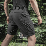 M-Tac Aggressor Summer Flex Shorts i brug, designet til træning og udendørs aktiviteter, med funktionelle lommer og justerbar talje.