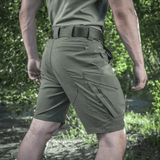 M-Tac Aggressor Summer Flex Shorts i grøn med praktiske lommer og elastisk talje, perfekt til udendørs aktiviteter og træning.