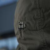 Detalje af lynlås på M-Tac Flash Jakke i let og alsidigt design til vandreture og sport.