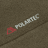 M-Tac Combat Fleece Polartec Jakke med Polartec® materiale i olivengrøn farve, der viser tekstur og mærkelogo.