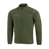 M-Tac Combat Fleece Polartec Jakke i olivengrøn med velcro-paneler og vindbeskyttelse, perfekt til taktisk og casual brug.