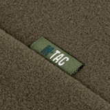 Nærbillede af M-Tac Sweater Nord Fleece Polartec Dame med M-Tac mærkelogo, lavet af blød og varm Polartec® 200 Series fleece.