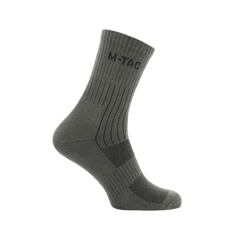 M-Tac Sokker Mk.1 i grå, designet til komfort og støtte, med polstring og ventilationskanaler til krævende aktiviteter.