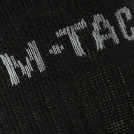 Nærbillede af M-Tac Sokker Winter Wool detaljeret strikmønster med merinould for varme og komfort i vintersæsonen.