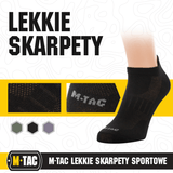 Sort M-Tac Let Sportsokker designet til løb, med ergonomiske trykpunkter og åndbart materiale, perfekt til udendørs sport.