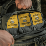 M-Tac Taktiske Sokker Ranger pakket i en rygsæk, ideel til komfort og aktiviteter udendørs, med elastisk kant og anatomisk pasform.