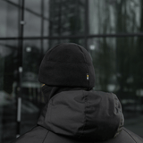M-Tac Watch Cap Elite Fleece Beanie Hat Slimtex i sort, set bagfra, velegnet til taktisk brug og vinteraktiviteter, sort baggrund.