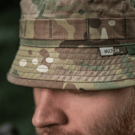 M-Tac Panama Hat Gen.II NYCO close-up, camo pattern, showcasing durable NYCO fabric and MOLLE interface, worn by person outdoors.