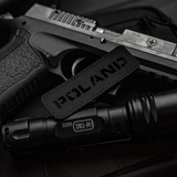 M‑Tac Patch Poland End-to-End 25x80 i Cordura 500D med velcrofastgørelse og Laser Cut-design, vist sammen med sort udstyr.