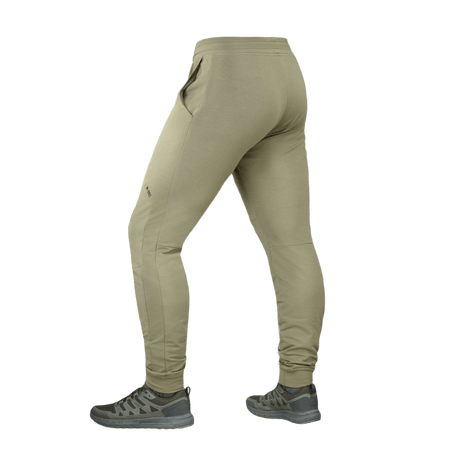 M-Tac Bukser Stealth Active i beige, set bagfra, viser komfortabel pasform med elastiktalje og lommer til løb og hverdag