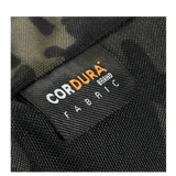 Nærbillede af M-Tac Konvert Taske Elite med Cordura 500D og Cordura Hex 1000D, der viser etiketten med materialemærkning.