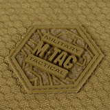 Nærbillede af M-Tac Konvert Taske Elite etikette i Cordura materiale, der viser holdbart design og kvalitet.