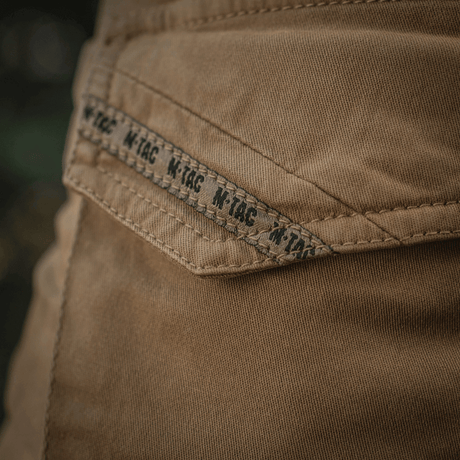 Detalje af M-Tac Bukser Aggressor Gen.II Vintage i kraftig bomuldsstof med vintage-finish, ideel til stil og funktionalitet.