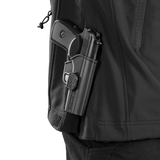 M-Tac Soft Shell Police Jakke med lukket våbenhylster til præsentation af jakkeegenskaber og alsidighed i forskellige situationer.