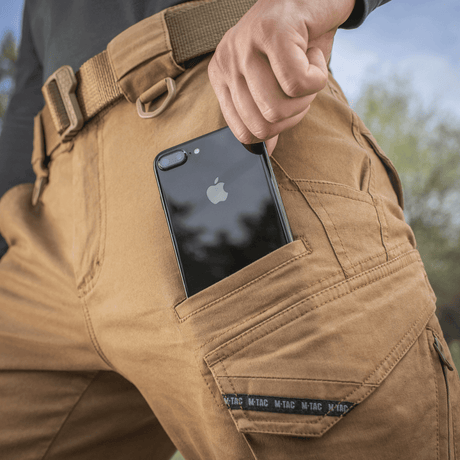 M-Tac Bukser Aggressor Vintage i robust bomuldsstof med lomme til smartphone, giver styrke og stil med industriel vintage look.
