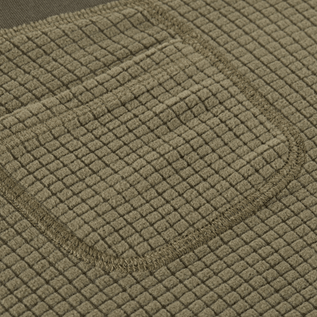 Detalje af fleece stof på M-Tac Fleece Termobukser Delta Level 2 Lady, viser tekstur og lommedesign.