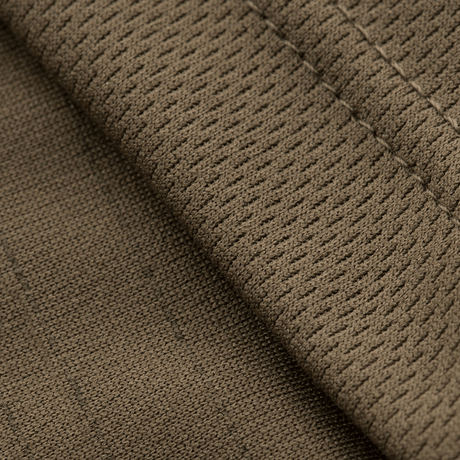 Nærbillede af stoffet på M-Tac Sweating Ninja-Balaclava, fremstillet af 100% polyester for optimal svedtransporterende funktion.