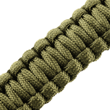 Nærbillede af M-Tac Paracord Armbånd med Ildstarter, Kompas og Fløjte i grøn farve, ideelt til overlevelse og friluftsliv.