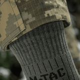 M-Tac Sokker Mid Calf Mk.4 til mænd, designet til komfort og beskyttelse under trekking, med polstrede thermozoner og elastisk kant.
