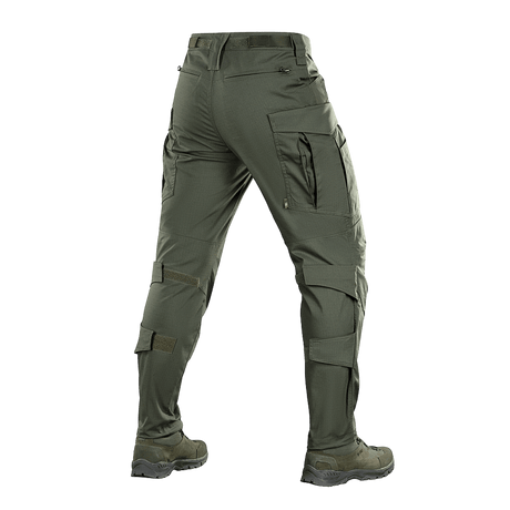 M-tac Taktiske Bukser Conquistador Gen. I Flex i grøn, ideelle til udendørsaktiviteter med slidstærkt Rip-stop Flex materiale.
