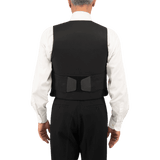 Anorak Topaz® VIP I Stiksikker Vest set bagfra, vist på en person iført en skjorte og bukser, med hook & loop-lukninger.