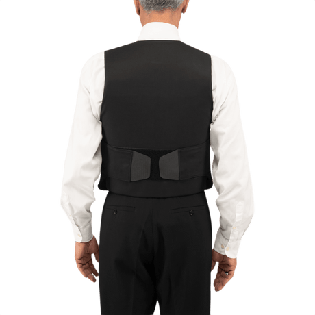 Anorak Topaz® VIP I Stiksikker Vest set bagfra, vist på en person iført en skjorte og bukser, med hook & loop-lukninger.