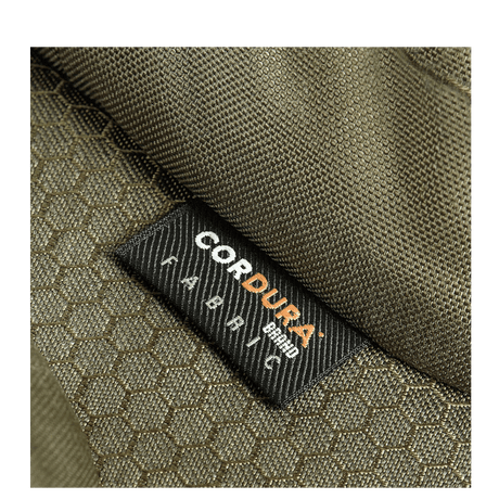 Nærbillede af M-Tac Bat Wing Taske Elite Hex med robust Cordura Hex stof i grøn farve med tekstur, fremhæver holdbarhed.