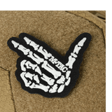 M-Tac Buckler Taske Elite Hex med skelet hånddesign på Hex-Cordura taskeoverflade i sort og brun farvekombination.